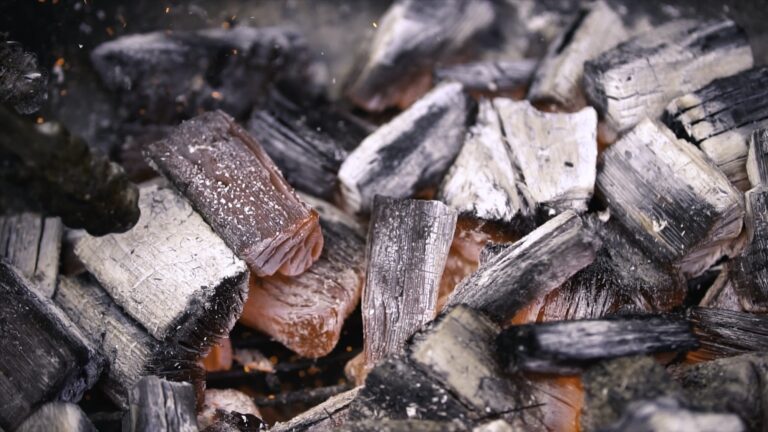 Red hot burning charcoal preparing for grilling, barbecue grill. Preparation of coals on the