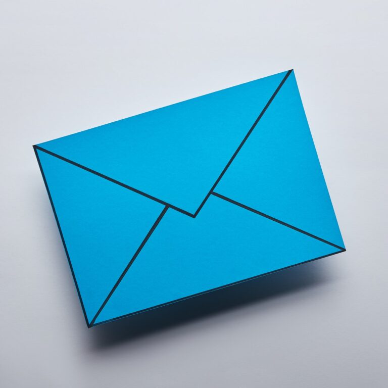top view of blue email sign on grey background